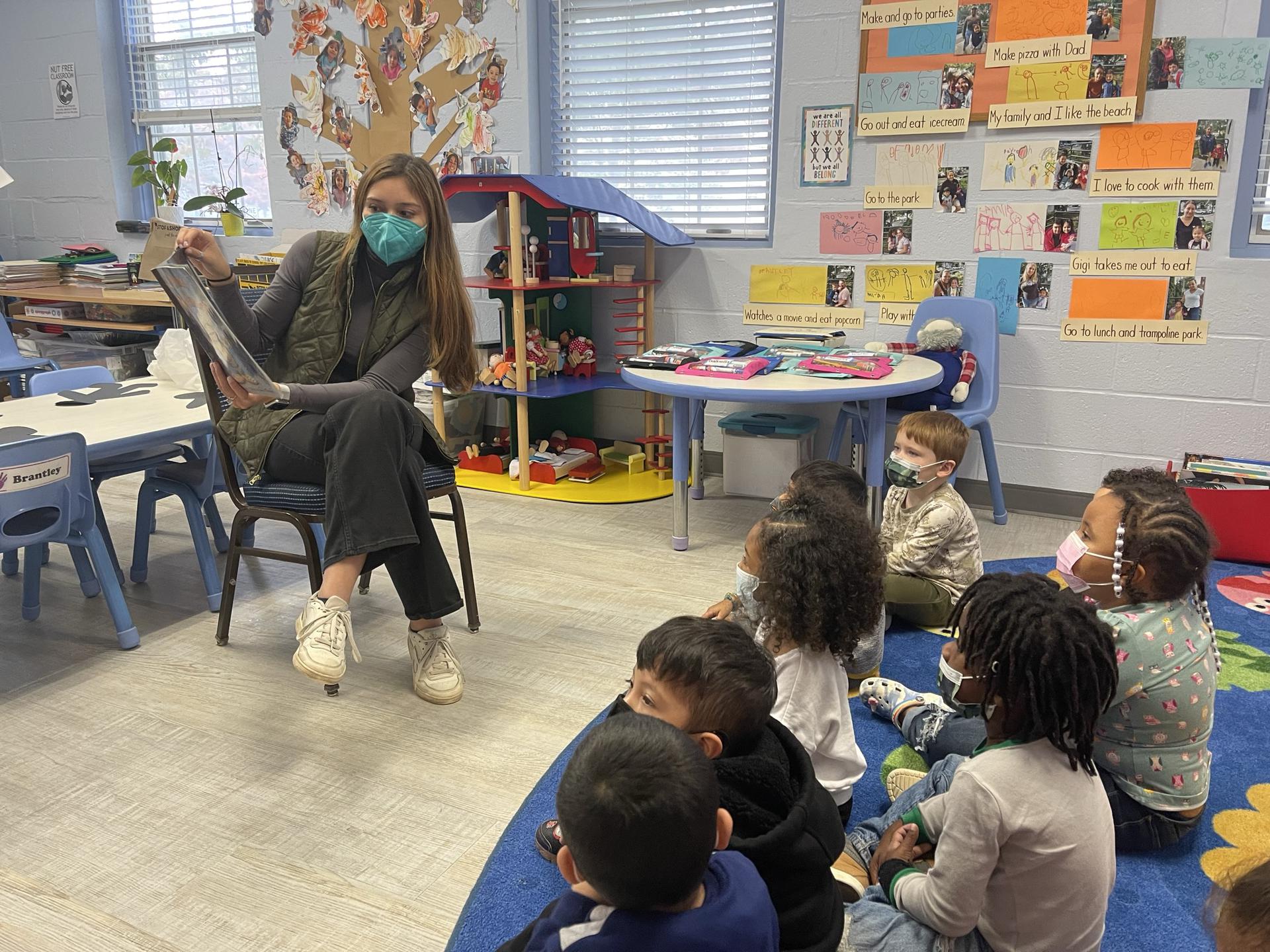 Salve Intern Reads to students