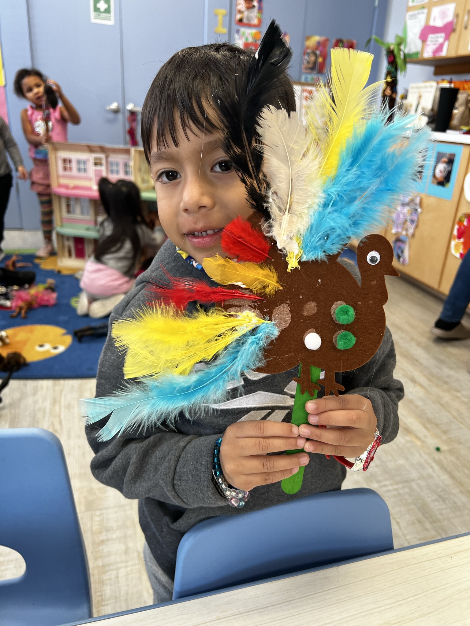 Preschooler with turkey craft
