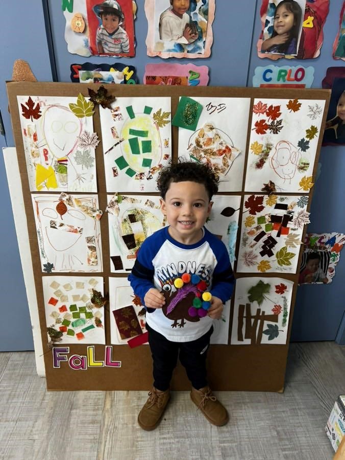 Preschooler with turkey craft